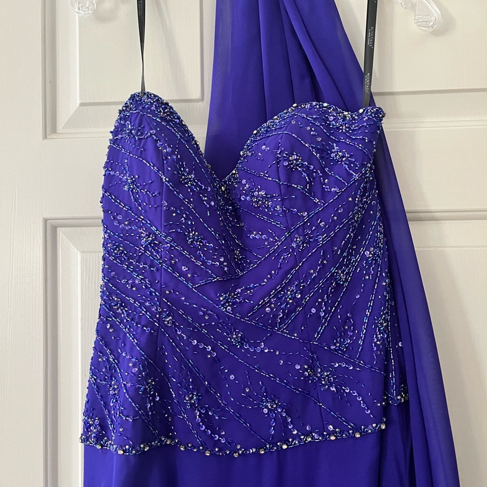 Montage by Mon Cheri Purple Embellished strapless Gown with sheer wrap.